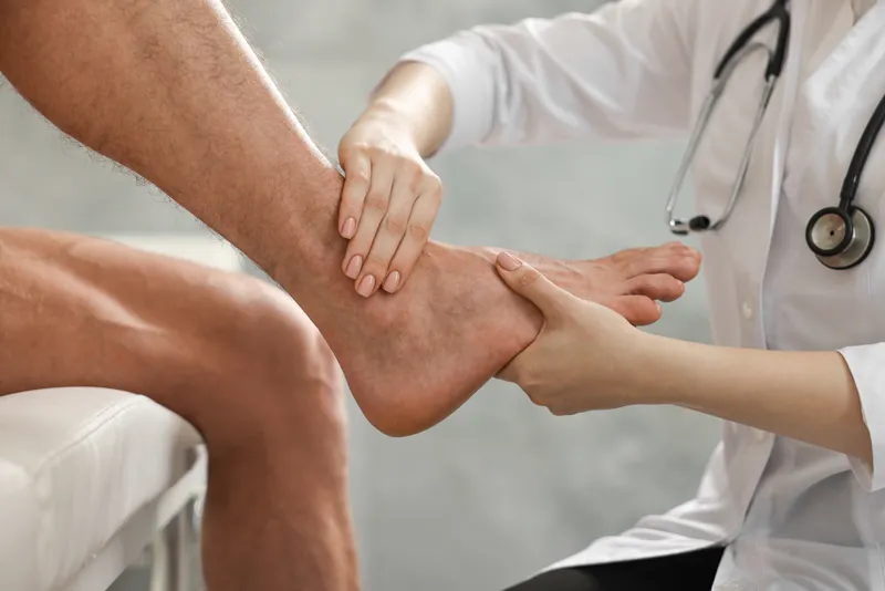 Foot specialist evaluating a patient's foot